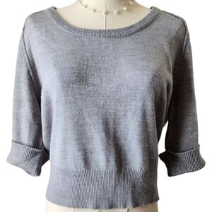 Cropped sweater. Feminine lace, raw edges, and button details. Size Large